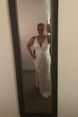 It runs a little large in the waist and bra area but perfect around my hips. I really like the dress. And I love the plunging neckline. I ordered a XL if I chose this dress I will have to get a large. - Michelle R.
