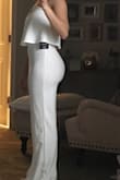 Absolutely in love with this jumpsuit! I plan to wear it to my rehearsal dinner. The White is not see through at all. Thick fabric. Don't need a bra either. Fits true to size. I'm 5'1 & as you can see I will definitely need a lot hemmed off (I am even wearing 4 inch heels in this picture & it's still really long) but I am used to this being so short. Debating on buying even more colors! Thank you LuLus! - Ashley C.