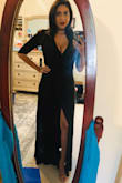 I wore this dress to a wedding, and it so comfortable! The slit was pretty high on me, but I have long legs, so if you have a longer torso, the slit should be just right. I am a little busty, so I couldn't really adjust the cleavage, no matter how hard I tried. That made me a tad self-conscious, but the husband loved it, so I guess it's a keeper. I bought both a small and a medium. The material is stretchy enough that they both fit about the same. I kept the medium because it was a little longer and I wore stiletto sandals. The back of the dress did sometimes get caught on the back of my shoe, but surprisingly, it never tore. Extremely soft material, not heavy at all, and I was outside a lot wearing this black dress and not once did I get hot. - Erika O.