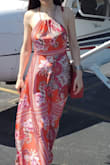 This dress fits nicely and reaches the floor, it's just the right length for my height, I wore small heels of about 2.5". 
I'm a student pilot, and took my boy for a flight in a small airplane for his birthday wearing this dress. It was windy at the airport, and the fabric, albeit polyester, is of such perfect weight, it flowed beautifully around me in the wind. In the evening we also went out for a dinner, and all eyes were on me. Overall it was very enjoyable to wear. I also got the same in blue. I totally love them both!!!
I cropped our faces out of the pictures because of Lulus Terms and Conditions for content, so I reserve my exclusive rights to my face LOL - Yekaterina P.