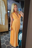 I am so in love with this dress! The orange color was mango-licious! I just wore it on a family cruise and got tons of compliments from even the restroom attendant! Haha. Alteration for length and lifted the shoulders to tighten the chest area since you couldn't wear a bra. Material was stunning! One of my best on line purchases from any company! Classy and flirty. - Sharon C.