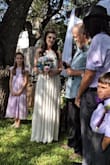 This was my wedding dress & it was absolutely perfect! Simple like I wanted yet very high quality material (nicer than I expected actually.) I was nervous the length would be too short but it was very long I had to wear heels & I'm 5'5". The only downside was trying to find a strapless bra for it which just don't work for me. Ever! I ended up tucking the straps of a regular bra & just wearing a tube top type of thin bra over that which worked fine. Also I had to take in the sides under the arms because I really needed an XS but they were out of stock :( Other than that I loved it & am still in love with it! - Kandice M.