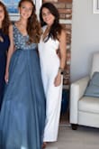 I bought this for a party where I had to wear white. As expected, the pant legs were way too long and I had to have it hemmed. I expected that. But the straps were also a little long on me (because I am short I guess), which meant that the V in the front went a little lower than my strapless, backless bra clasp. Luckily it was see through so wouldn't show up in the photos, but I was tugging at it all night. Other than that, the jumpsuit is a great material. It comes fully lined so it will not be see through as other white jumpsuits can be. Stretchy material that is thick enough to not show every imperfection, but also flattering in the right places. - Vanessa V.