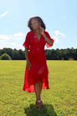 I wore this dress for my birthday--just to take photos and go to dinner in.  When it arrived, I was super pleased with the way that it fit: it was conservative and sexy all at once, and the bold red certainly made a statement.  Perfect in every way! - Kaelah P.