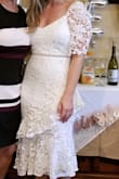 This dress was form fitting and classy, a perfect style for my bridal shower. I got so many compliments! I was a little unsure about the sleeves because they kind of bump up at the top like shoulder pads. Felt more awkward than it looked at first but didn't bother me after. It was very flattering on me but as other people have stated, material is not stretchy. - Cori T.