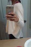 Thos sweater is super cute! I ordered a small im 5'6 116 lbs. It's more of a crop sweater but not short ypu wont see belly button or anything and it's so flowy and cute plan to wear it just with leggings. - Miriam M.