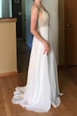 This dress is absolutely gorgeous! Every stitch and bid is nicely done, I haven't noticed any loose elements. Quality and the price are great. I was concerned that it might be see-through but fabric is actually opaque. Dress is long for my height (5'5") so I'll definitely will need alternation. It's gonna be dress for my wedding reception and I can't wait to dance away in it! - Maria R.