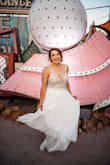 First off, the quality of this is UNREAL! I had it tailored to fit my bust and length. She works with ball gowns that costs thousands and she couldn't believe the cost of this and the quality that it is. It was a little longer, but I am sure if I did not wear Sparkly Keds with this, it would have been perfect with heels. It was perfect for my wedding in Vegas getting married by Elvis. This dress deserves 5 starts because it was absolutely perfect in every way!!! - Sarah P.