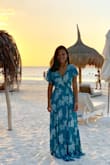 I can't speak more highly of this dress! The color and fit is gorgeous! The lining provides enough coverage so that the skirt is not see-through. It's slightly long when I'm in flats but I'm sure with low heels it would be perfect. - Kim T.