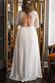 I had the sleeves altered into half sleeves, shortened the front of the dress for a sort of high/low affect, and tightened some around the waist. The dress was perfect and gorgeous. I was comfortable all day long and felt like a queen. The back of the dress was amazing too!! Very quick shipping and the online chat was EXTREMELY helpful. - Kayla G.