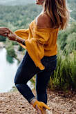 I purchased this top for my Save the Date photo shoot. Absolutely LOVED the turn out. The material is a lot thicker than I expected, but this is totally ok as it will be a nice fall shirt as well. I have a longer torso, so I did pull it down often as I didn't want any belly skin showing. - Holly N.