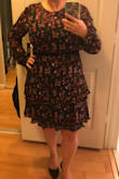 This dress is really cute.  It's a good length, the print is lovely.  The bust area actually works for me, even though I have a large chest.  The only negative is the sleeves are really long.  I thought the sleeves would have elastic around the wrist but it doesn't and so the sleeves hang past my finger tips.  If I keep this, I will have to get the sleeves altered.  If there was a button or elastic at the wrist, the sleeves would be better. - Tiffany G.