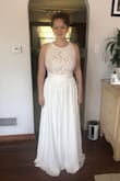 I'm going to wear this dress to my rehearsal dinner. It is so beautiful, even more so in person. The only negative thing I have to say about this dress is the neck line doesn't want to stay centered so it looks a little lopsided is you don't adjust it right. - Emily G.