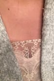 I love this, feels good and fits true to size (technically I am a 33 bust) and went with the small. Only things I don't like is that it's a little too short on me and the lace on the front curls down. - Ashton S.