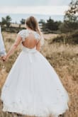 Ordered the smallest dress on website but still too large for me. Easily altered though.
Really like it but it's really see through, need to buy skin colour underwear. Used as a wedding dress with a pink skirt over it, so I could remove the skirt to dance at night. - Amandine B.
