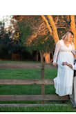 I got my dress super quick. I've never been a girl to dream of a big poofy dress on her wedding day. I was skeptical about ordering my dress online without even trying it on, but I couldn't find anything simple and beautiful like I wanted which this dress seemed to have. Once I received my dress, I instantly fell in love. I had to do a little fixing to make it fit perfect but I could it have imagined wearing anything else. There are no regrets and I am so happy with my decision. My husband was in love with the dress and the price! - Ariana C.