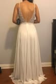 I love this dress. I knew when it looked good on every single woman in the reviews that it had to be something special. I love backless dresses and the bodice has very pretty beading for such an inexpensive wedding dress. I had been worried the pads would look like floating boobs but they blend in well. I looked in other wedding stores and online but this was the best I saw, even compared to $1000+ dresses. I need to get the bottom hemmed and possibly shorter straps for a better fit but I'm so happy with this dress! - Hope
