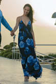 It fits perfectly, it is true to size besides it has the adjustable strings at the back if you want it loose or tight. I used this dress for my engagement photoshoot & a friend wedding. I am in love with it & I am happy that I made this purchase. - Kate T.