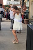 I ordered a medium. It was weirdly baggy under the armpits, but it would have been way too short if I went down in size. I had it taken in around my chest area and then it was great!
Lol I included a picture of my terrible dancing to show the length! - Jacquelyn S.