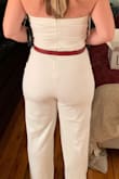 Bought as a possible rehearsal dinner option. I loved how this jumpsuit made my body look. It made my waist seem small and curves look great from behind. But it was so long! I'm 5'8 and even with heels, I was tripping over my feet. I didn't love it enough to pay money to get it hemmed, but it really was a great fit otherwise. Returned just because it was white and I wasn't wearing it for the intended occasion. (Added the belt just to try on for photos because it felt too plain without one). - Cori T.