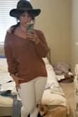 Loved the mauve color and the soft feel! I usually wear a medium or large in tops and ordered the medium which I felt made me look bigger than I am. Exchanged for the small pictures with the white jeans. If you are looking to pair with leggings go with the bigger or your usual size. - Nicole H.
