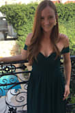 I wore this dress in Greece for a beautiful outdoor wedding. The green color is a nice emerald, and the bust area fit nicely. I did feel as though I needed to keep pulling up the bust area, but maybe that's because I'm a little self-conscious. I did get it hemmed to fit the length, but I do have very short legs in comparison to the length of my torso area. I wore comfy sandals underneath, but no one could see them anyway. It was easy to move around dance all night. - Alison G.