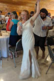 It turned out to be a beautiful, simple wedding dress! Fit was perfect, very flattering. Only complaint was it looked weird if you lifted your arms up, the drape part would flip up. - Sarah T.