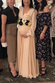 I decided to look for a wrap dress since I'm pregnant and not sure what size or dress would fit my belly lol. First I ordered a medium and it was too small for my chest area so then I went with a large and it fit great! The length was a little long but I didn't mind because if I decided to wear heels it would've been perfect! The arms were a little loose but didn't look bad at all, they were flowy. Lovee Lulus! Always great pricing and great quality. - Fatima S.