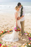 I wore this dress for my beach elopement in Maui and it couldn't have been more perfect! I I tried on several other dresses at bridal shops but I couldn't find anything that I liked more than this dress, especially for the price! It is extremely well made and the lace details are gorgeous.  It is a little see through but with a slip it was not an issue. I did have to have the length hemmed a bit I'm 5"1') but other than that it fit like a glove! I would absolutely recommend this dress! - Emily O.