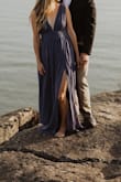 I ordered this at the last minute for my engagement photos after returning several dresses. It came 1 day before and I'm so glad it did! It's definitely low cut and the top was a little loose, but you can pull it down to where it fits without getting it tailored. It flows so beautifully and the denim blue color was lovely. I'm not sure I would wear something like this in real life, but I loved it for photos. Credit to Nicole Ashley Photo for the pictures! - Susanna B.