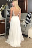 I ordered this dress and another to try on for wedding dresses. This one is really beautiful and high quality. I ended up going with the other one (which was a lace style so very different). This one would be perfect if you're looking for something: elegant, simple, classy, unique, or a little glamorous. The dress was comfortable. I didn't wear it too long, but the rhinestone top didn't seem to both my inner arms. The back is gorgeous also, and feels so elegant! Additionally the bra cups are not as noticeable in person as in the Lulus photos. I recommend trying this dress! - Lauren E.