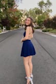 Loved it! Great fit and color, the fabric is a little stretchy and thick enough to not need a bra or pasties. Length is good, and the skater skirt is really flattering. Went with silver shoes but could have worn beige or black instead. - Linda K.