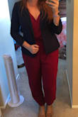 I'm in the groom's party at my best friend's wedding, and I thought this jumpsuit would be perfect. It's not, but it's too late to order anything else now. I'm between sizes, so I got a medium and a large. The medium was snug in the legs, but the top fit well. The top kind of bulged awkwardly at the sides though. The large fits my legs comfortably, but holy moly is the top way too big. It billows way out on one side and the back won't stay up. I'm going to use a belt to keep it bunched up and with a blazer over it hopefully it won't look too awkward. Far from my best Lulus purchase. Would not recommend. - Rebecca A.