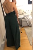 I love that this jumpsuit could be worn instead of a dress for an occasion. I'm usually a medium but the zipper just fit in the back. The neck line and slots are so fun. I am tempted to keep it even though I might not wear it to the occasion I intended to. Note that the legs are pretty wide and roomy. - Lauren L.
