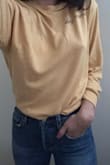 It's a fuzzier material than I expected - in a good way! Very soft, thin material, and the perfect yellow. Not too bright or mustard-y, or verging on the orange side, just the perfect pale-ish yellow. - Clarissa E.