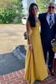 Beautiful mustard color gown. Great quality fabric. Runs a little big in my opinion. I had to get an XS as where I'm usually a size small. - Vanessa V.