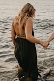 True to size, I say runs a little small because I am 5'7 and the straps made the top of the dress a little too high. I felt like it should've sat lower. I'd recommend getting a size up. - Katlynn K.