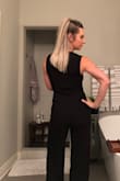 I bought this jumper for a wedding and it was perfect! The material is stretchy but not cheap looking. I have a difficult time finding the length I like but this jumper was perfect for my height. I paired it with 3 inch heals! I also layered it with a black blazer because it was a little chilly for no sleeves. This would be sexy as hell for a night out on the town too. I usually wear a size 6-8 and bought the medium size. It wasn't tight or baggy. It was a perfect fit. - Brooke J.
