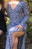 This dress is BEAUTIFUL... Wore it to a wedding that I wasn't too sure was casual/more dressed up. Paired with the right heels it could go both ways. I'm 5'4 and with 3" heels I had no issue with the length. You can tie it front or back and the material is very light - Abby F.