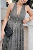 Wore this to a wedding and it was beautiful, did not picture very well in daylight though, it's really a dress to wear at night and to take pics in at night with flash photography! (Pic attached) 
Since I was wearing this to a wedding, I wanted it to be a bit more modest so I sewed the top up a bit so it wouldn't show too much, it ended up being pretty cute but went home and cut off the thread after the wedding lol. 

Only complaints: doesn't look the best in photos during the day and the waist part was fitted and pretty darn tight. I didn't want to size up because everything else fit perfectly, but man the waist was pretty tight!! - Julianna N.