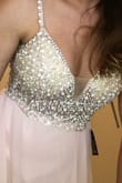 I got the pink one, it fits beautifully.
I may have to get the dress hemmed because I am wearing very small heels for my wedding, but I think it's gorgeous.
I tried to get an up close picture of the front for you.
Great quality as well. - Danielle H.