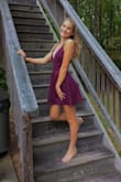 I bought this dress for my daughter as a surprise based solely on her telling me what she was looking for, then took her out and let her shop the stores- I was willing to risk her not liking it because of the free return policy. She found nothing at department stores and was thrilled I surprised her with this- and I was thrilled that she loved it!
As others have noted the material is a nice heavier weight poly that does not look cheap, it has some stretch but just for movement, and it lays beautifully. There is boning at the bust to maintain the plunge which is a great feature. This is not a dress that you'd wear a bra with because of the front plunge and strappy, open back, and my daughter was concerned it might bare the dreaded side boob so we purchased some double sided tape to secure it and it worked just fine- no issues securing to this fabric and truly it might not have been necessary- it fit well, more of a safeguard. It is a shirt dress and she wore her volleyball booty shorts underneath because squatting doown low might expose you, but she also wore heels- shorter girls or girls in flats might not have the same issue. Did I mention she was Honecoming Court and made a grand entrance in this dress? We could not be more pleased. Also- I had a teeny problem tracking my order when I paid via Amazon and Lulus customer service team was GREAT. I mean on it right away, resolved, AND it came 2 days early. We will definitely buy here again and highly recommend. - PIMA H.