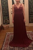 This dress is beautiful in all the detail. I ordered a size 2, it was a half size too big. Normally the size I order so it ran big. It was also made for someone a lot bigger. The backing is so pretty but I have a small bust and shorter so it gaped open in the back! After getting a lot of alterations done, I couldn't be happier with how it looks. It really is a beautiful dress, gorgeous detailing, and good quality. Hope to wear it for multiple occasions! - Savannah S.