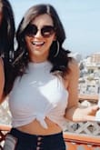 Was pleasantly surprised by how cute this shirt was. However, it is paper-thin see-through. You see an outline of a beige bra. The sides also come down low so you can see the bra.

Very soft, you could make it work like I have, but wish it was not so see-through. - Lauren F.