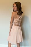 The dress was beautiful. My daughter is a bit Tiny so I had to tighten the back a little bit and cut the length of the string in the back so it didn't exactly look like the image of the dress on here but was still gorgeous. Great dress for something simple and yet beautiful - Lisa B.