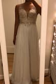 I was blown away by the intricate detailing and gorgeous silhouette of this dress. Perfect for a fairy tale fall or winter occasion. Love how romantic and sweet it is, with the lace-up back. The dress looks and feels so much more expensive than it is. The skirt is very long, however. After getting it hemmed, I can't wait to wear it as my engagement dress! - Christine C.