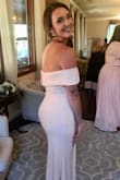 Wore this and got a ton of compliments! The sleeves stay up and the material is a bit stretchy so I would order your true size. Fit perfectly. I am an athletic build and was nervous the off-the-shoulder would look bad, but it worked perfectly! - Jenna B.
