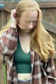 I love this shirt! It has an extremely soft material. My favorite part if you do not have to wear a bra with it. You can dress it up or dress it down. It's super cropped. I am wearing a size medium in the photos. - Cortney A.