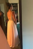 So, my sister's bestie threw herself a 40th Birthday Party of wedding proportions: A formal masquerade ball in Toronto. Yes, it was amazing, as was this dress! I felt like a freakin' Disney princess (a champagne-drinking, sailor's mouth kind of princess). The fit was great, although, if it had come in a 9, it would have been perfect. I have a broader back and because the zipper hit (literally like a centimeter too high) I couldn't get the 8 to fully zip. The 10 fit well and looked great, but I did have to maintain great posture to keep the straps from wanting to slide. In other words, my chest filled out the 8 much better than the 10 but the 10 fit in the waist better. I ended up getting those silicone bra pasties to help with the bodice sizing. It worked out great. Perfect length as long as you like to wear higher heels. I was impressed by the bead work of the bodice, very well constructed albeit a little heavy. I did have to cut the ribbons out that you use to hang the dress up because you could see them through the mesh underarms and I'm a little worried about the beaded straps holding up on a hanger in storage. But small complaints about an overall very satisfying purchase. - Ashley P.