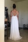 I love this dress! The beading on it was prettier than I could've imagined. It had everything I wanted too.. low back, light feel, whimsical look. I'm normally a size 4, which is what I ordered and it fit like a glove. For my height too it landed perfectly on on the ground, barely touching but would look great when I wore shoes. I seriously couldn't say better things about this dress. - Kayla P.